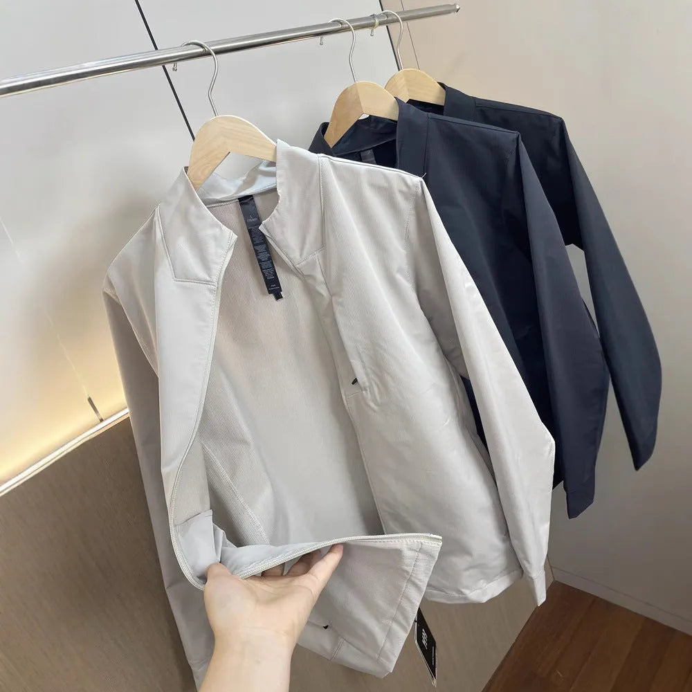 Men's stand collar casual jacket in polyester, shown in black, dark blue, or milky white.