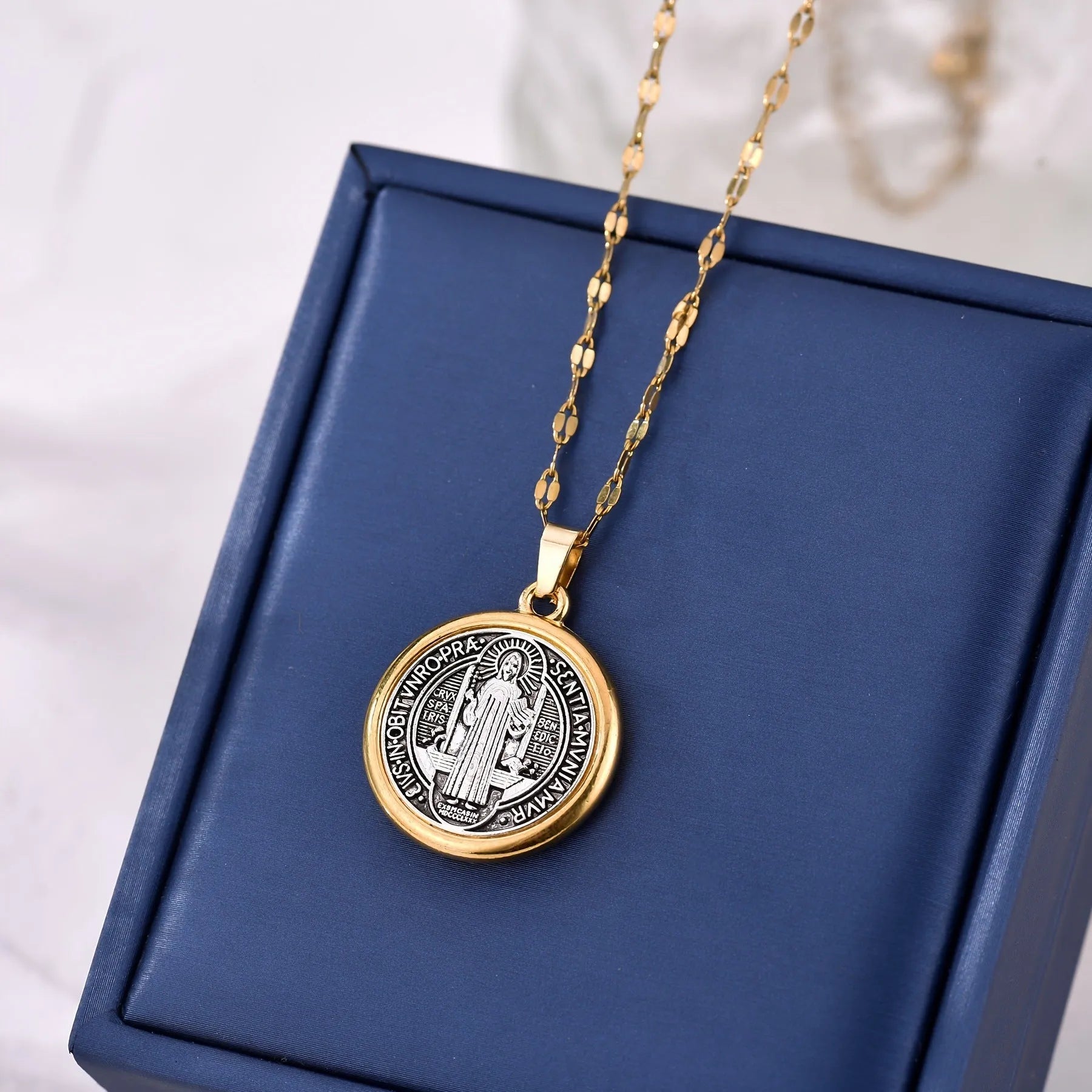Gold electroplated St. Benedict cross pendant on alloy O-ring chain necklace