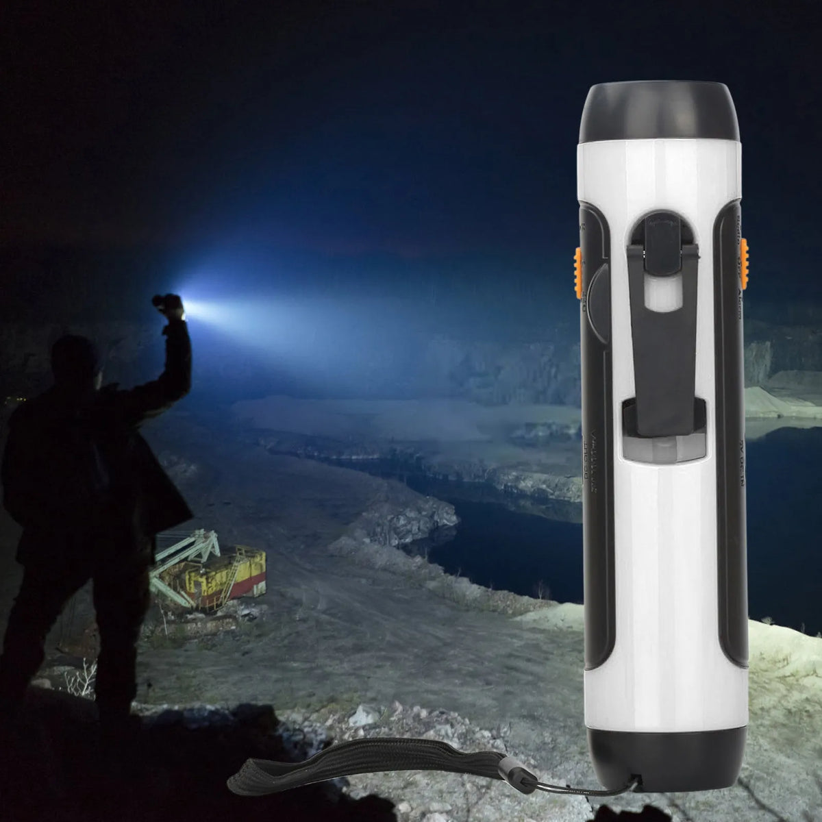 Orange emergency FM rechargeable alarm flashlight with hand crank on a dark outdoor background