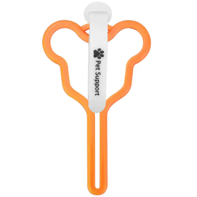 Dog poop bag holder with clip and velcro strap for leash attachment.