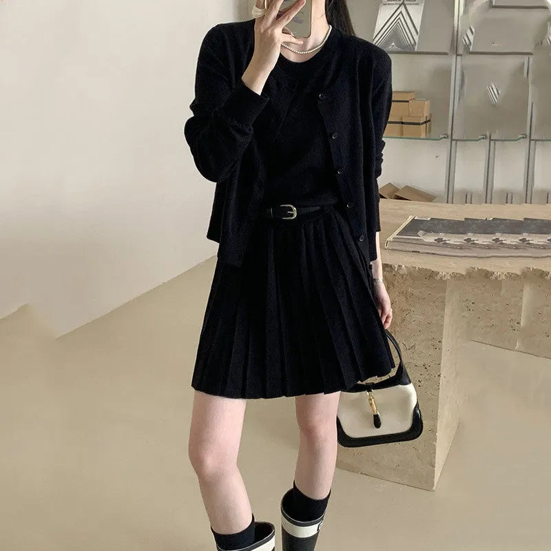 Grey knitted women's two-piece set with vest skirt, long-sleeved cardigan and pleated detail