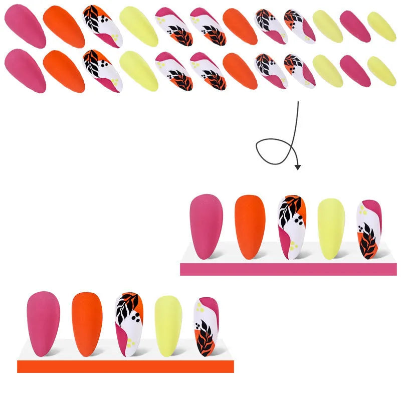 Set of four Wear Armour medium almond shaped frosted nail stickers showing French leaves, leopard print, macarons, and colourful plating designs.