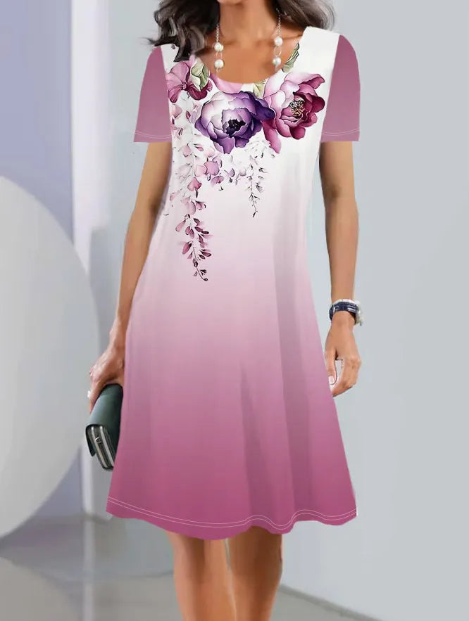 A woman's mid-length floral print summer dress with short sleeves and a round neck, shown in Element 3 colour.