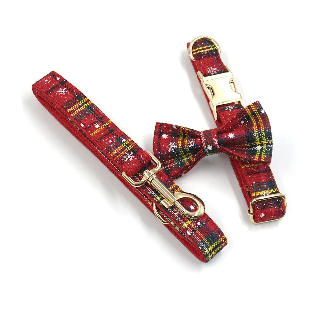 Red cloth Christmas dog collar and lead set with matching chest strap, bow, and waste bag.