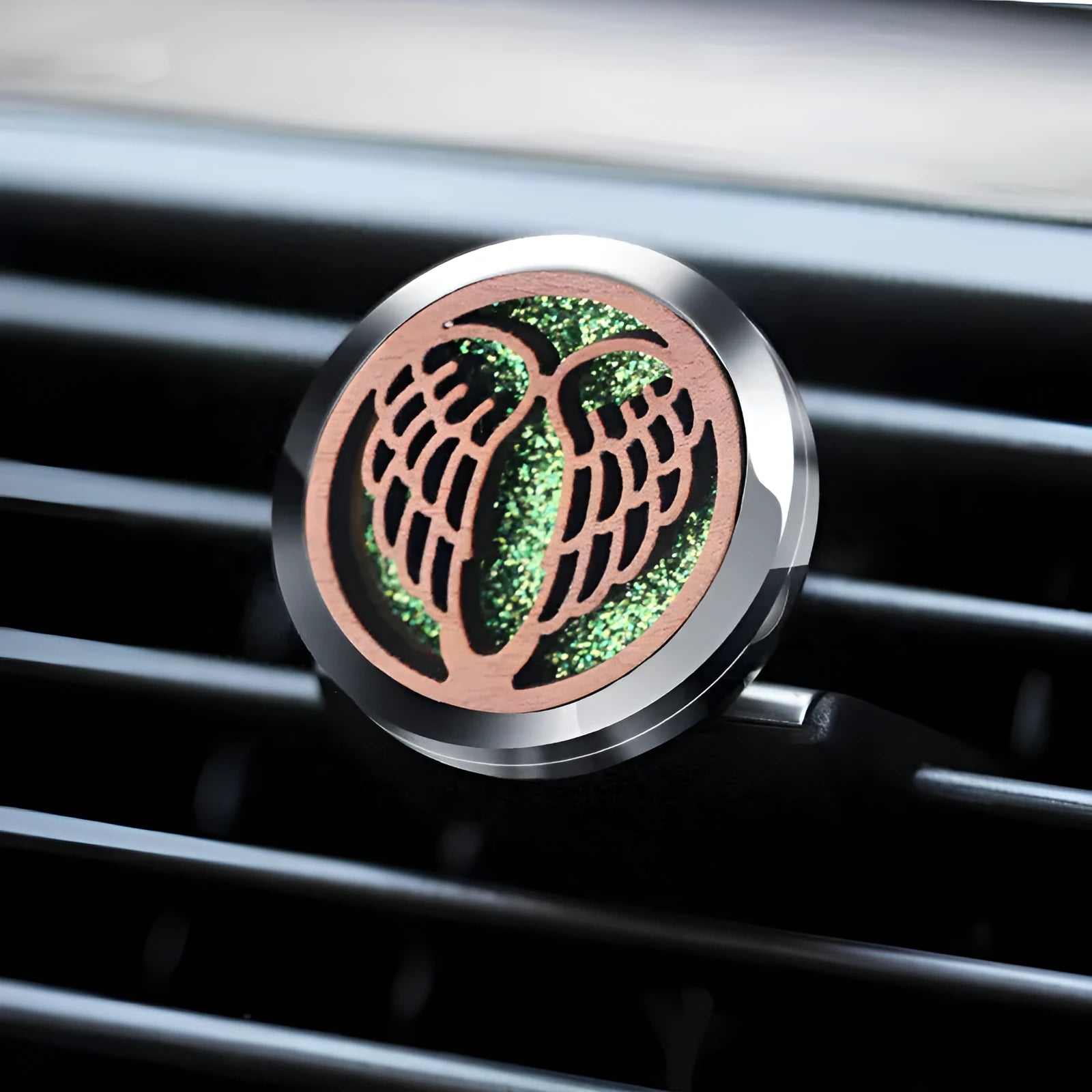 Round car vent aromatherapy clip in alloy wood construction showing hollow centre for incense