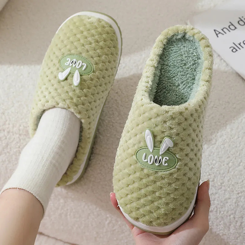 Rabbit plaid design women's plush slippers with anti-slip rubber soles in apricot colour.