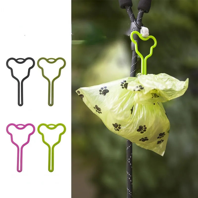 Dog poop bag holder with clip and velcro strap for leash attachment.
