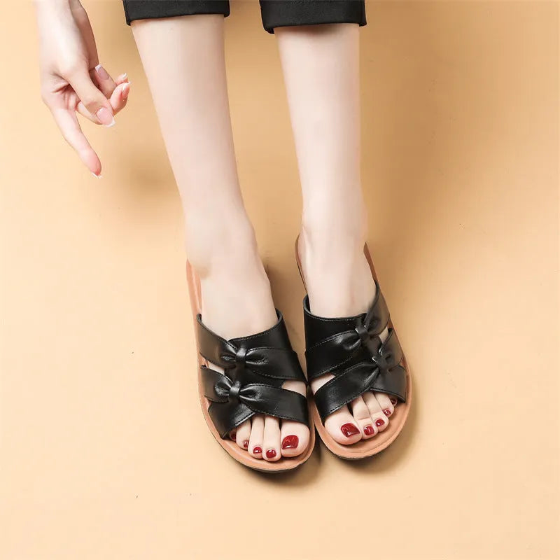 Women's cowhide slippers with soft bottom in red, black and beige colours