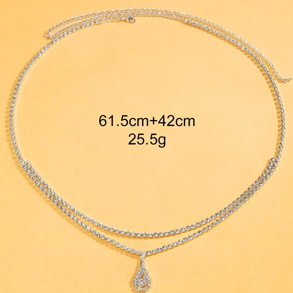 Gold rhinestone water drop pendant on a 115cm adjustable waist chain with lobster buckle.