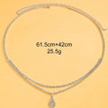 Gold rhinestone water drop pendant on a 115cm adjustable waist chain with lobster buckle.