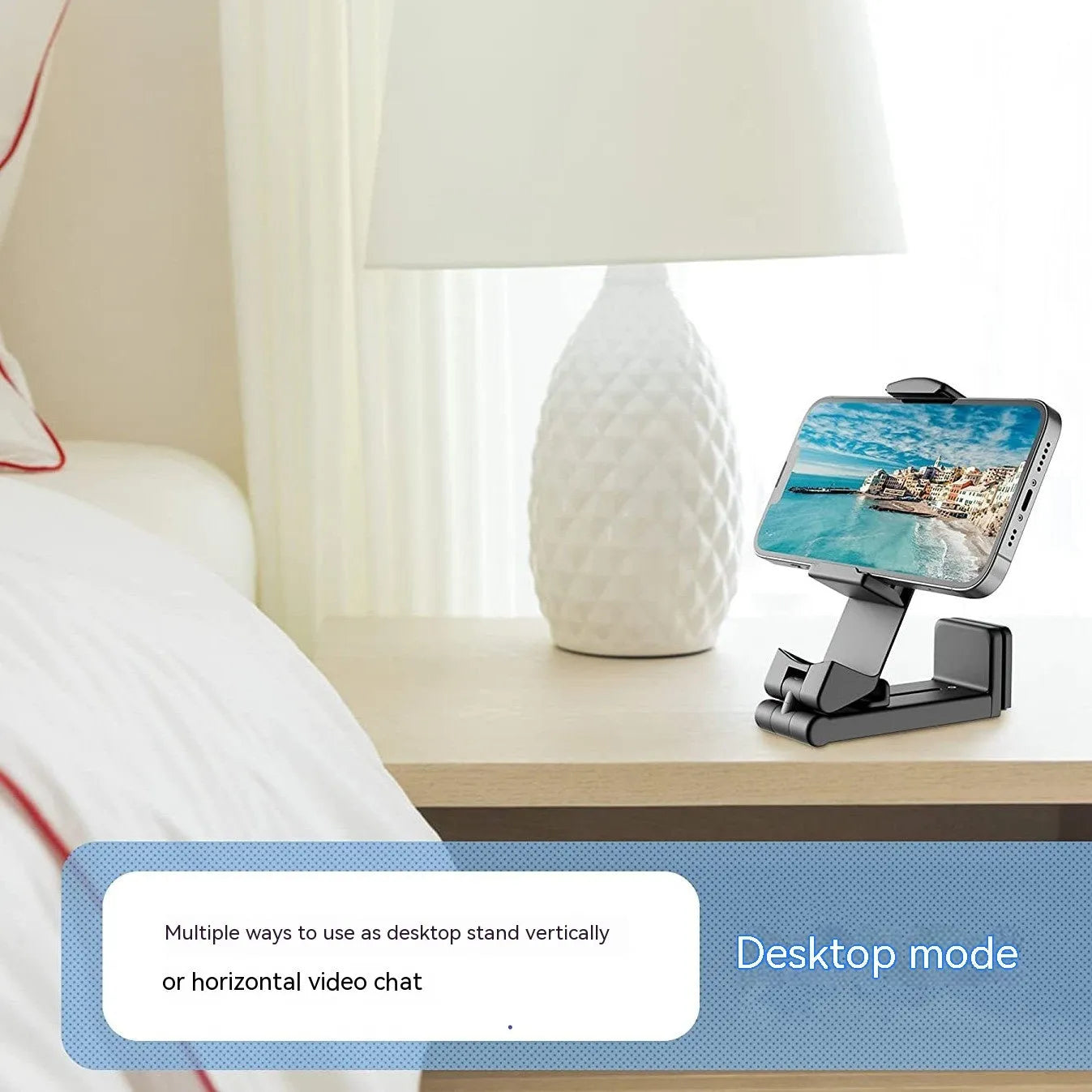 Foldable rotating universal mobile phone holder in black, shown open and closed, on a desk.