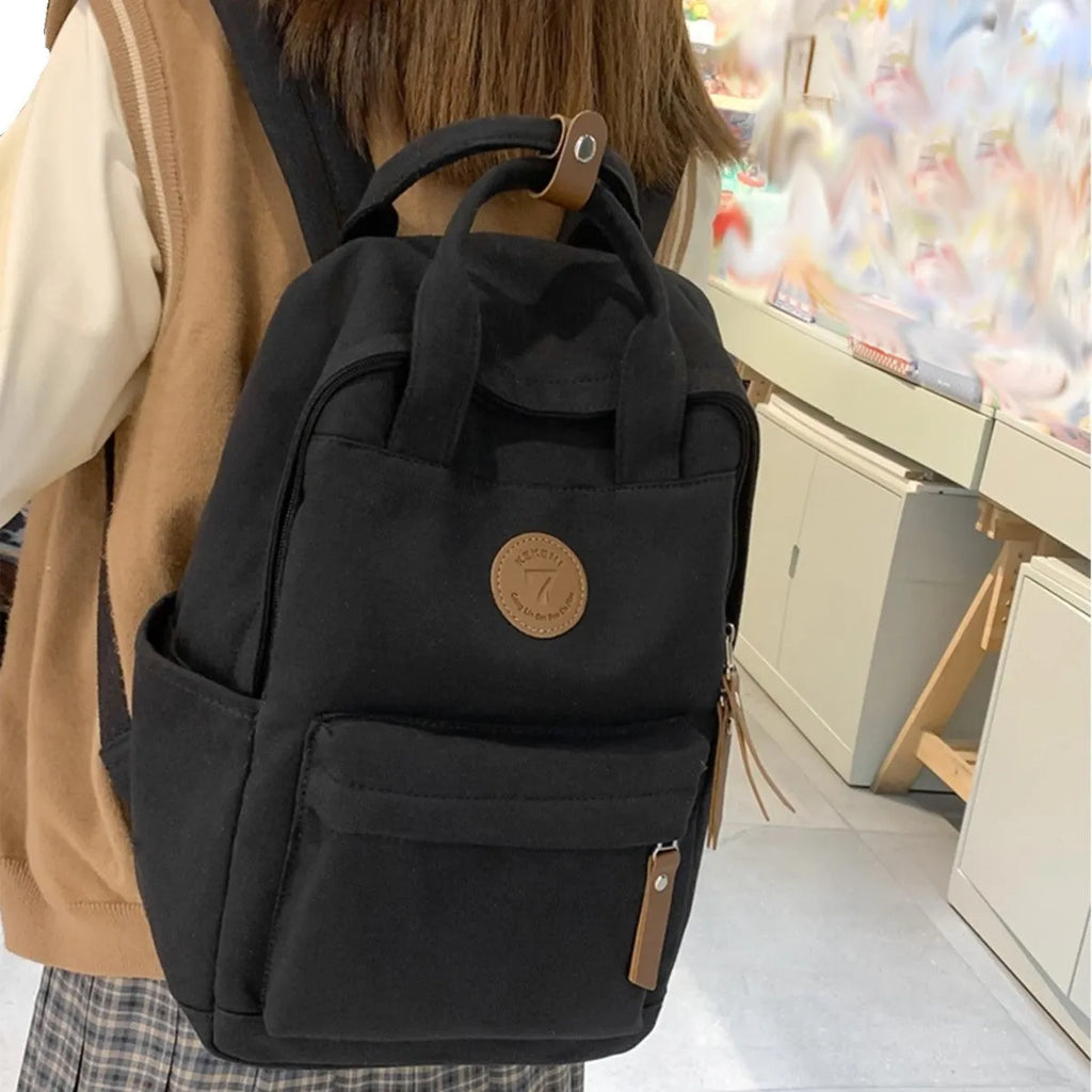 Black Oxford cloth leisure travel backpack with curved shoulder straps