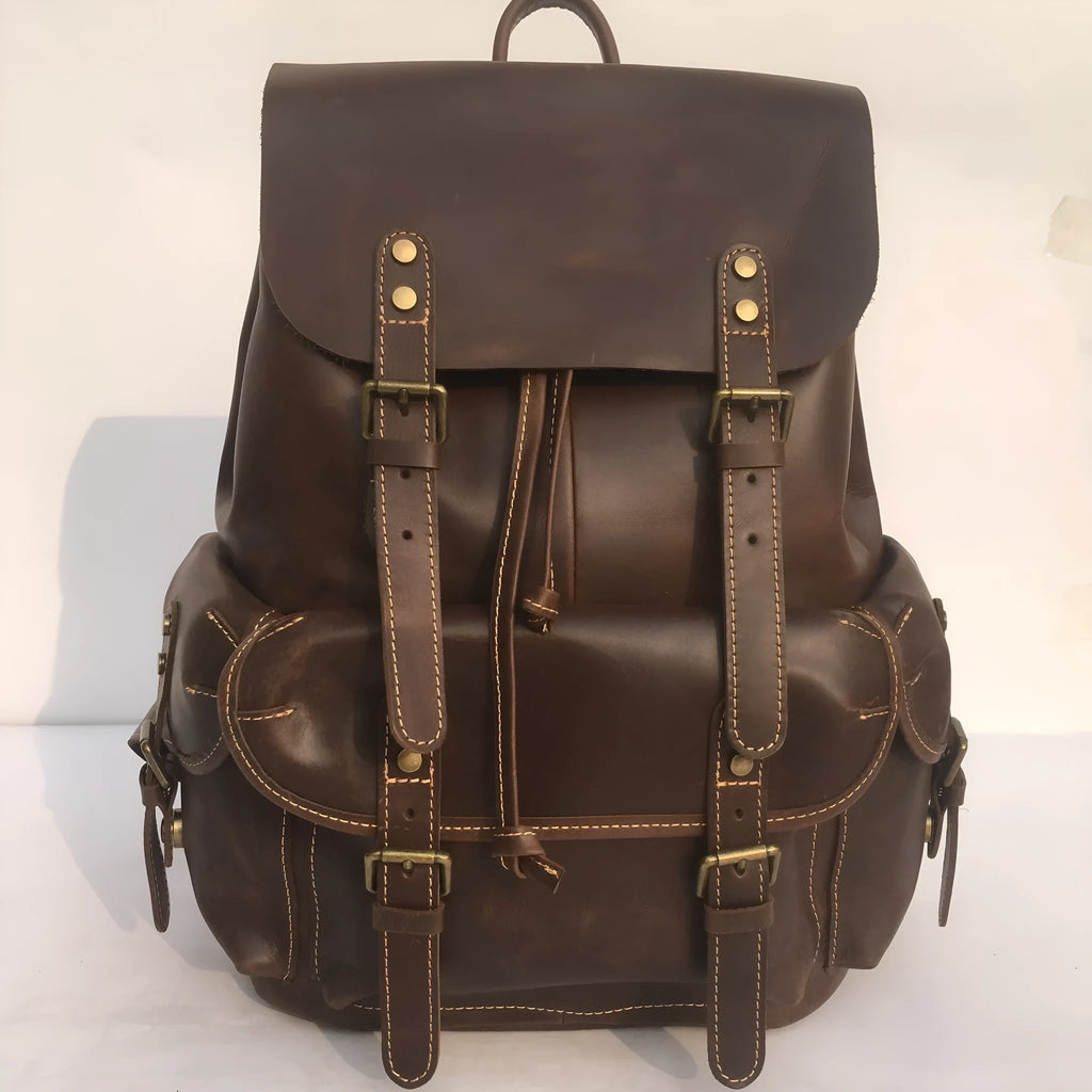 Brown men's cowhide leather backpack with air pillow shoulder straps and a single main compartment.