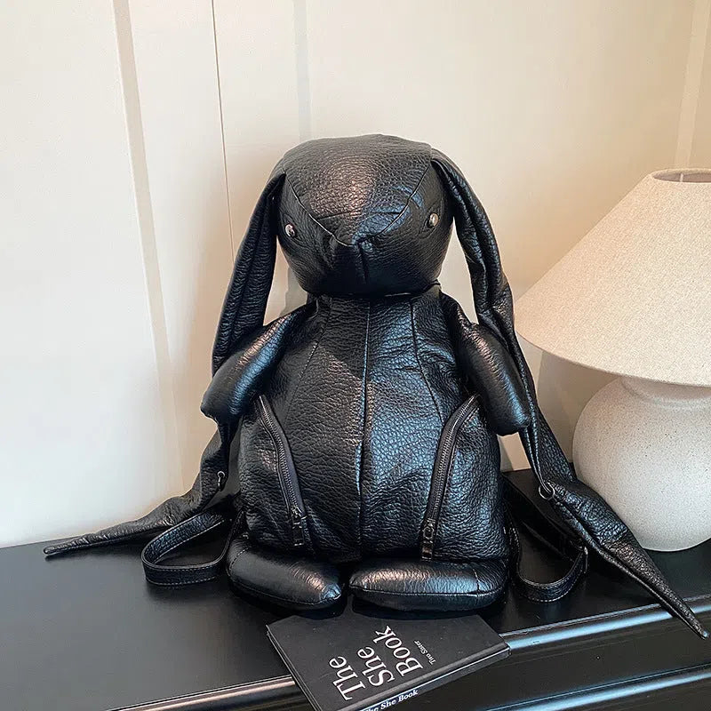 Black PU women's bucket backpack with double straps, patchwork stitching and internal phone, ID and hidden pockets