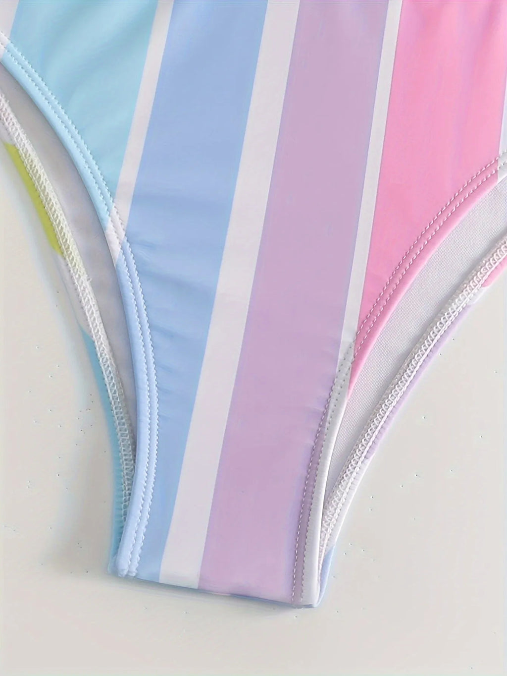 Women's striped bikini top and briefs set in a European and American style on a mannequin.
