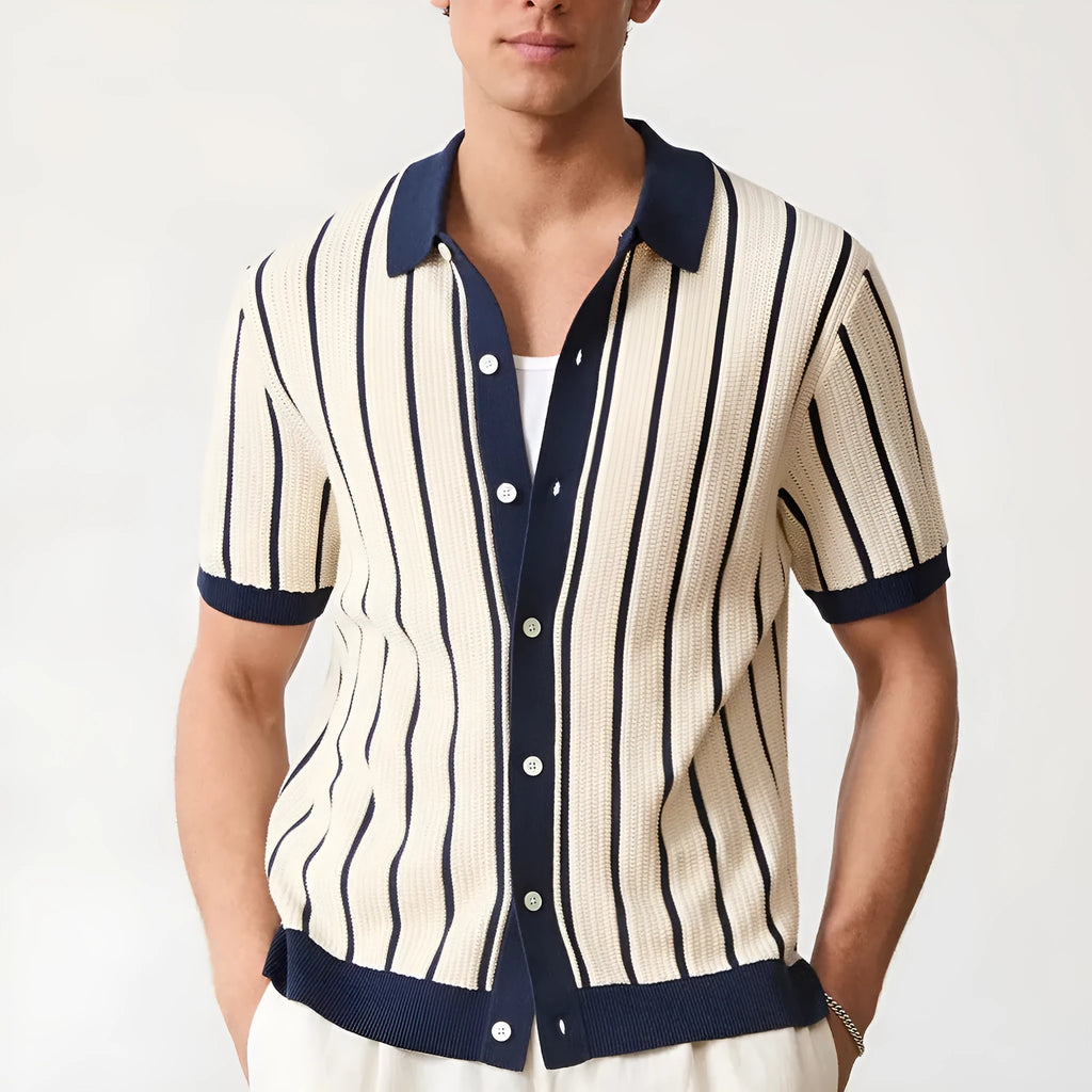 Men's white asymmetric lapel short sleeve knitted shirt laid flat.