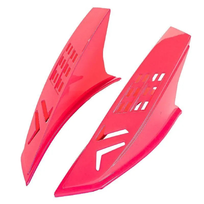 Pair of coloured decorative horn accessories for a child's motorcycle helmet.