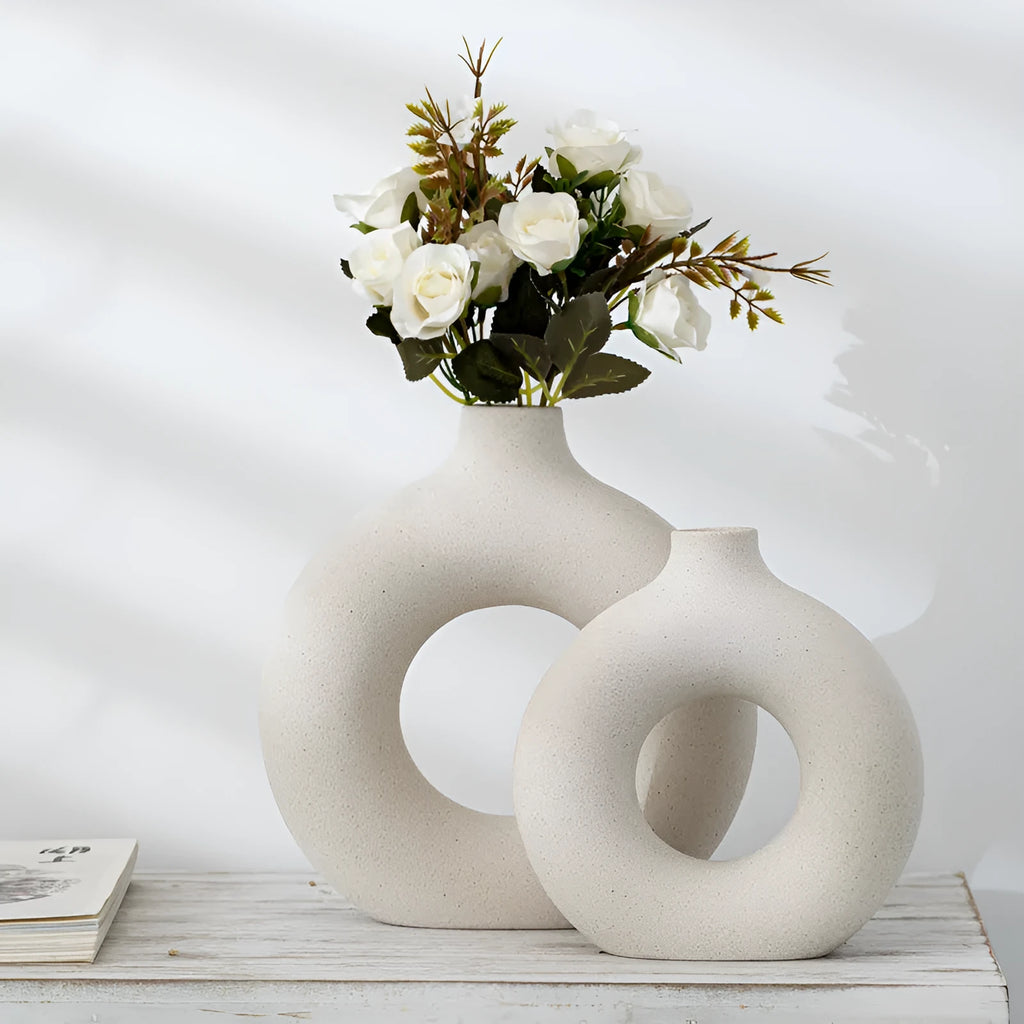 A simple modern frosted porcelain biscuit vase in a neutral colour, for flower arranging.