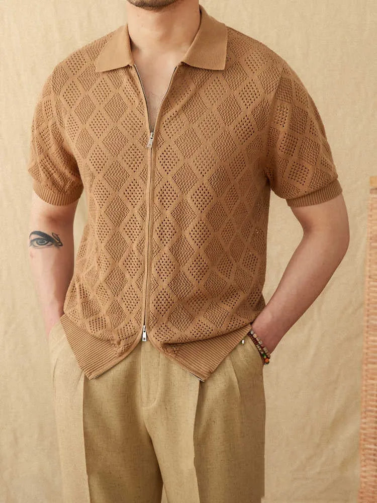 Man wearing a light brown zip-front cotton cardigan with short sleeves and a lapel collar.
