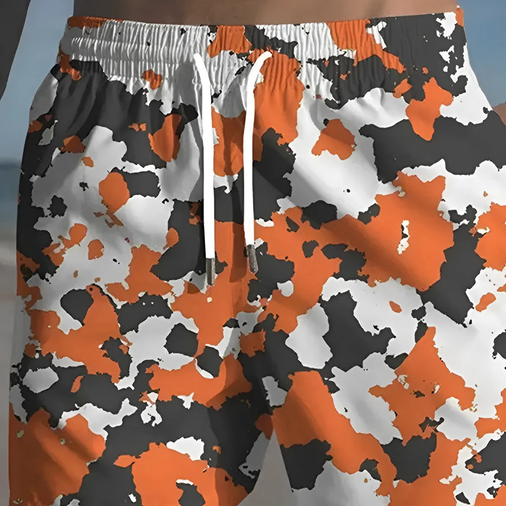 Men's polyester beach shorts with printed design and elastic waistband in multiple colour options