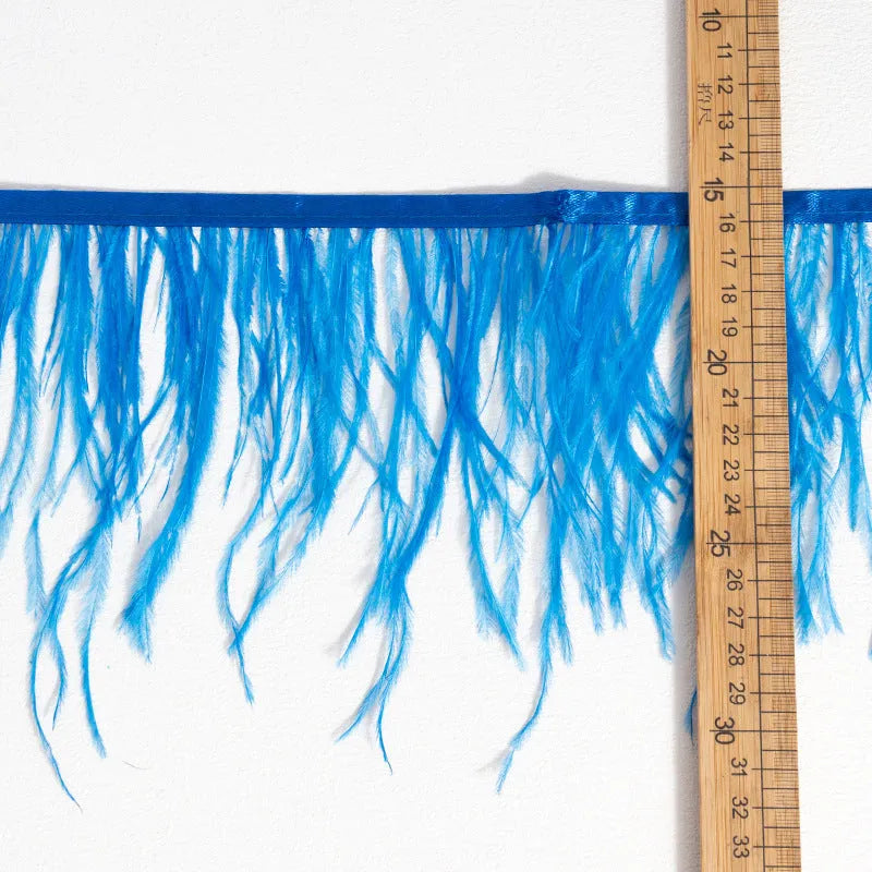 Decorative feather cloth strip in multiple colours including white, black, and mint green for DIY clothing and craft projects