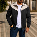 Man wearing a green windproof jacket with a high collar and front zip.