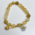 Handcrafted citrine crystal bracelet for women with a flower tassel in original design.