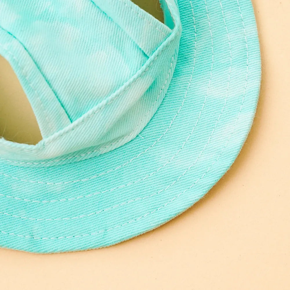 Pet sun hat for dog and cat with adjustable chin strap, polyester bucket style, available in multiple tie-dye colours