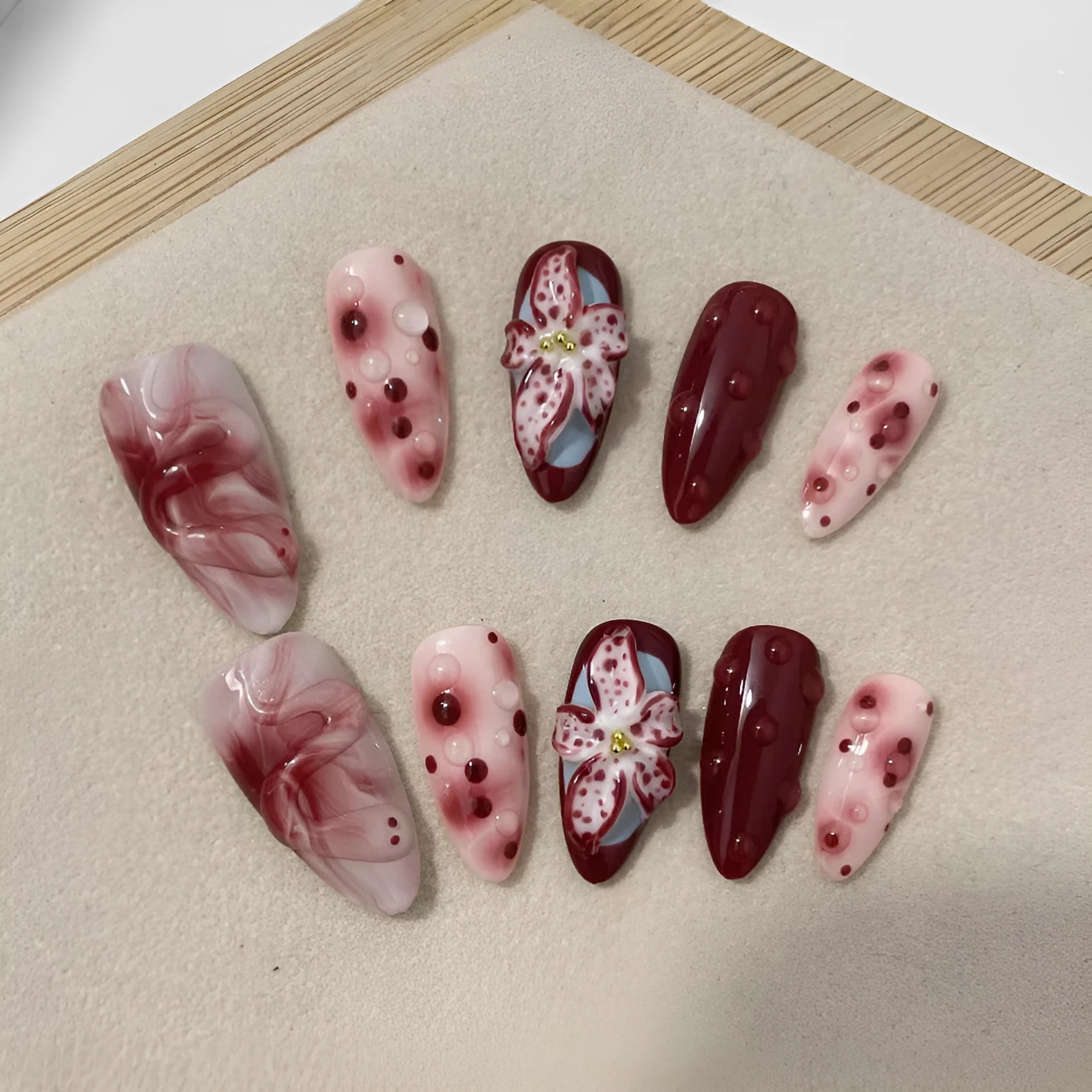 Hand-painted three-dimensional carved press-on nails in almond shape with rose, tulip, shell, bow, starry sky, butterfly, leopard print and XINGX patterns