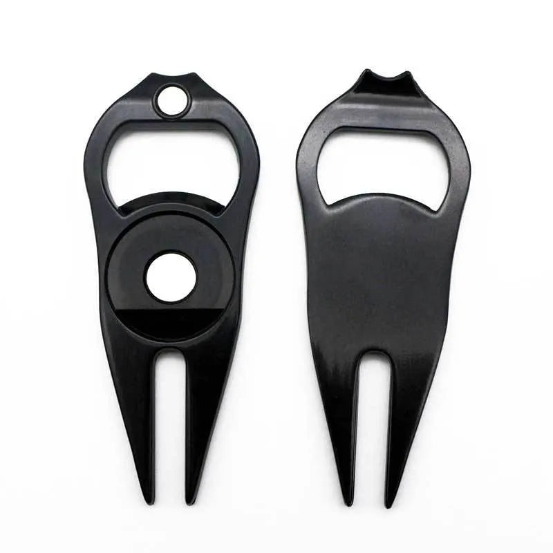 Zinc alloy golf multi-tool with ball yoke, bottle opener, and fork end on a green background.