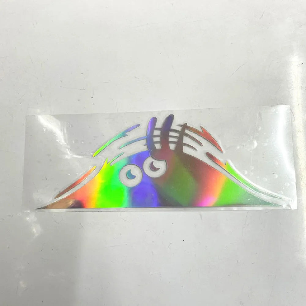 Self adhesive body sticker showing smiley and angry face designs on 19cm by 7cm size.