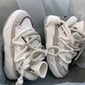 Women's grey chunky platform sneakers with thick soles and lace-up front