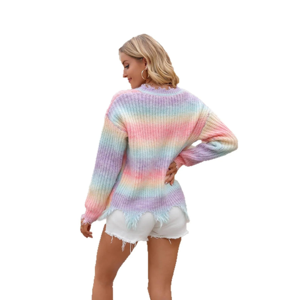 Pink rainbow gradient knitted sweater with loose cut design and tassel details