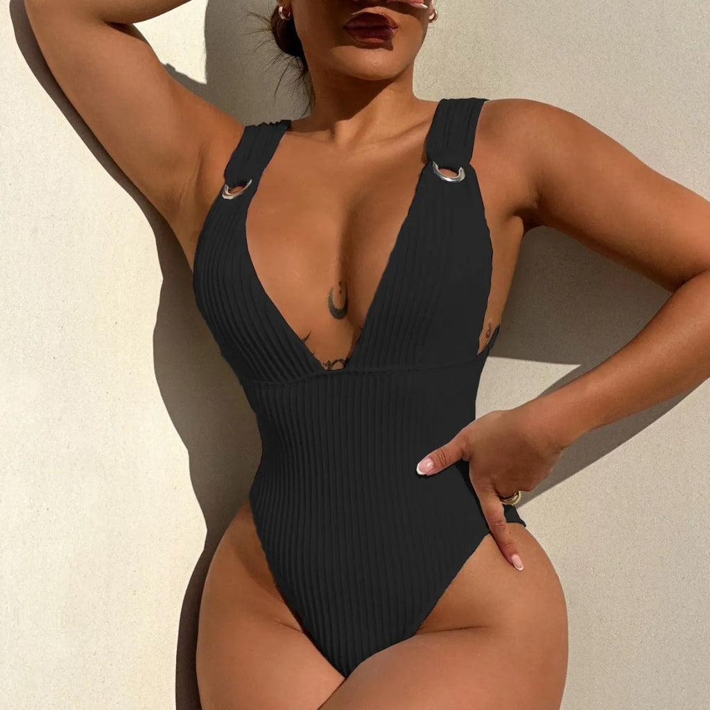 Solid colour one-piece swimsuit for women in black, shown on a model.