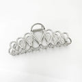 Minimalist large updo hair clip with tassel detail in gold or silver electroplated alloy