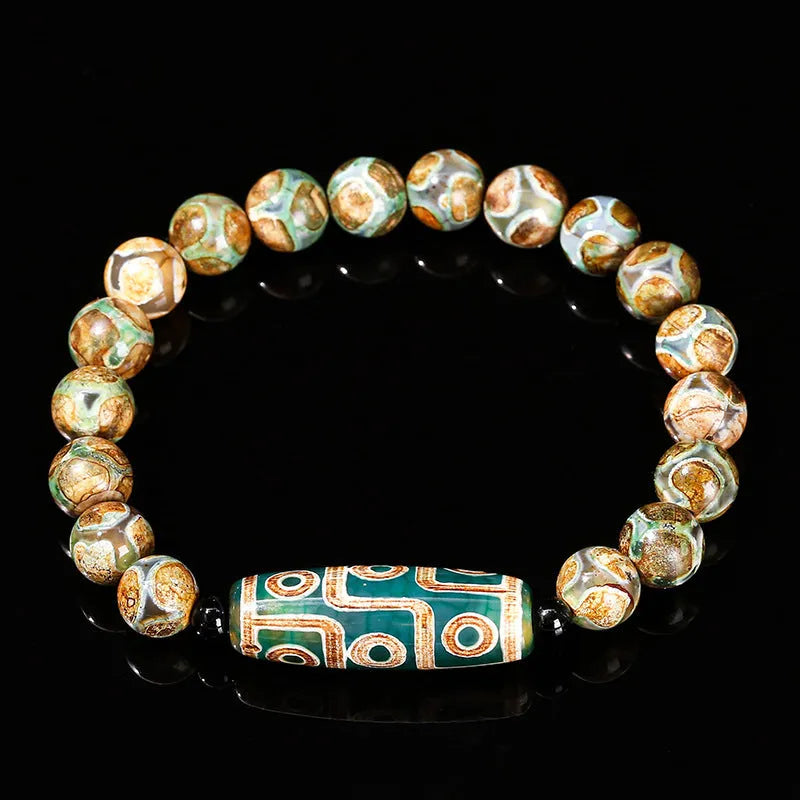 Green Dzi bead barrel shaped bracelet with 8mm handmade beads and Tibetan-inspired design