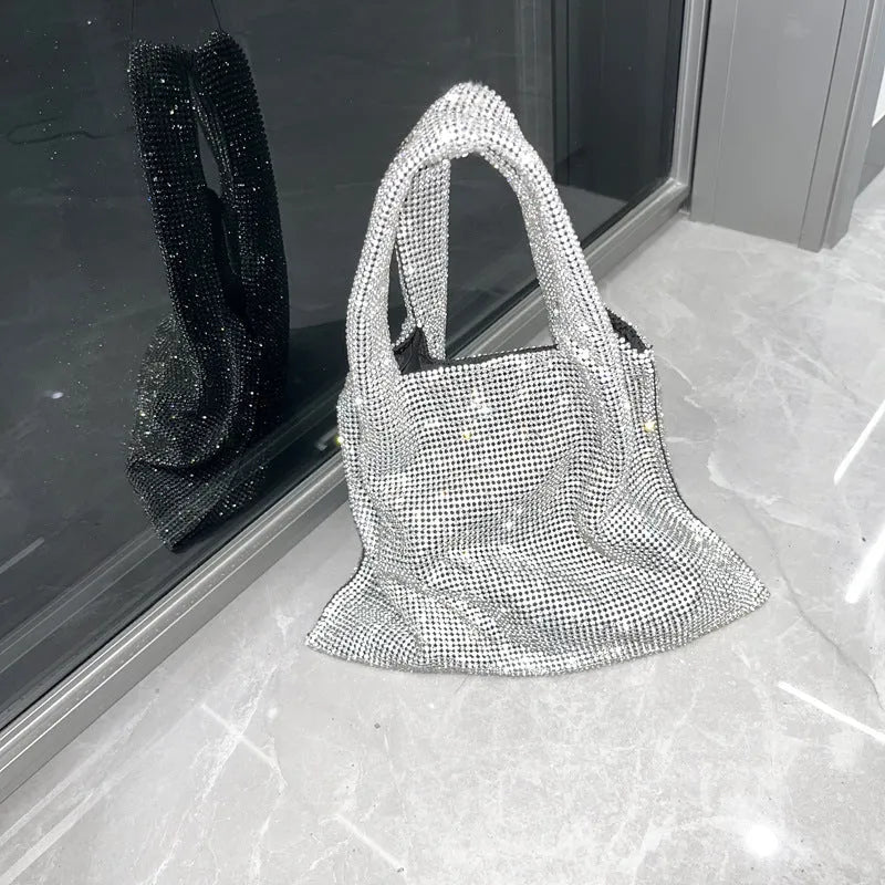 Silver cotton thread evening handbag with shiny rhinestone detailing and open outer pocket