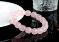 Pink crystal bamboo bracelet with 11x12mm geometric barrel beads on a wrist.