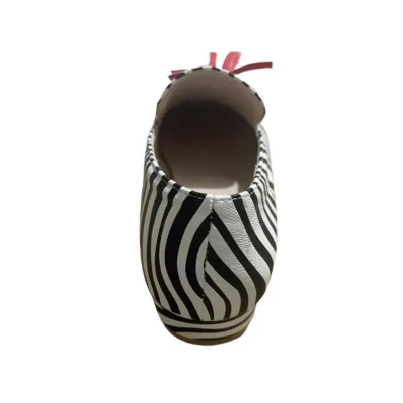Women's leopard print tassel flat loafers with round toe artificial PU upper on light background
