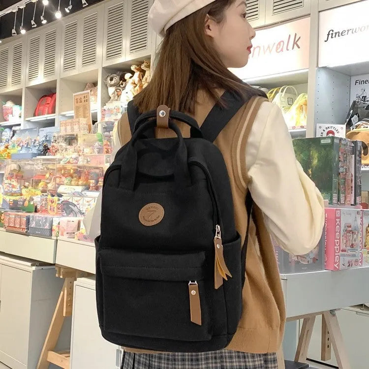 Black Oxford cloth leisure travel backpack with curved shoulder straps