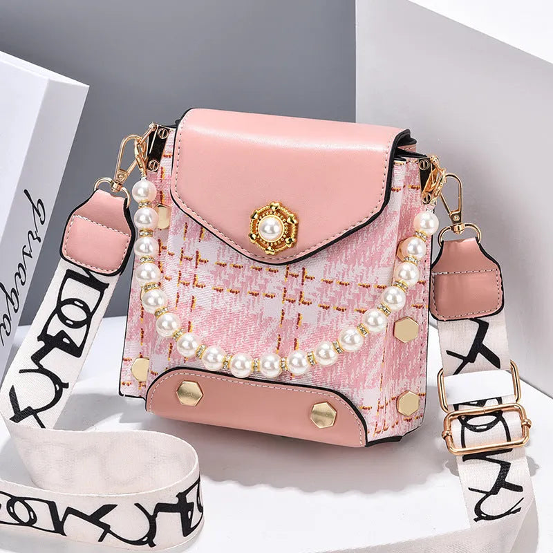 Women's crossbody phone bag in PU leather with pearl pendant and gold metal studs, magnetic flap closure
