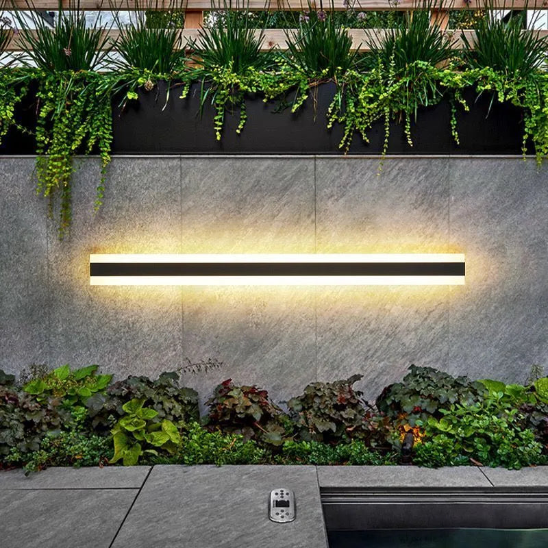 Linear outdoor wall lamp with IP65 waterproof rating and remote control for three light colours.