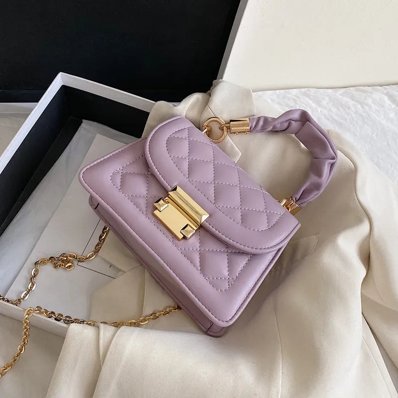 Small square purple shoulder bag with chain messenger strap showing dimensions