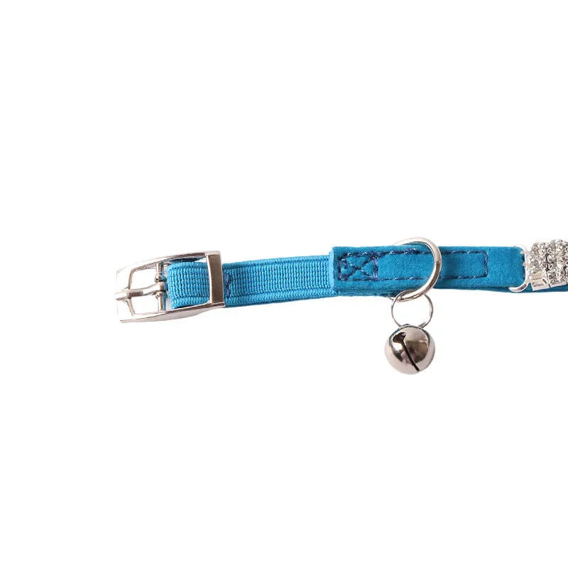 Soft pink flocked adjustable cat collar with elastic buckle on a 28cm length.
