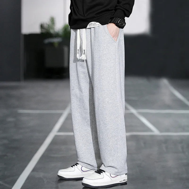 Men's grey Ninth Sports Pants showing high waist and multiple pockets.
