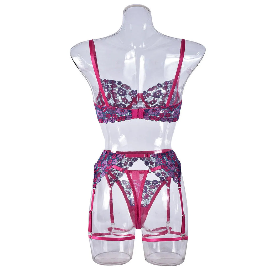 Rose red women's two-piece bikini with embroidered contrast detail on a mannequin.