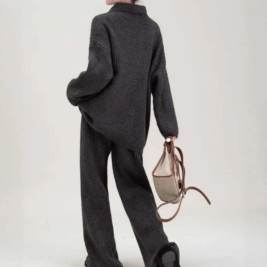 Women's beige knit two-piece set with long-sleeve top and trousers featuring collage stitch detail