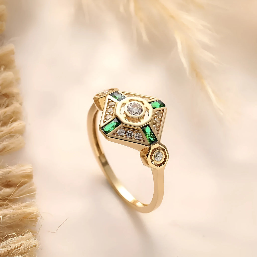 Square geometric ins-style women's ring with lvzuan coloured stones on a model's hand.