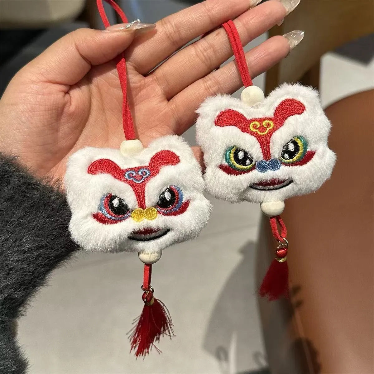 Chinese style blue plush lion keychain ornament with tassel and star stone decorative detail