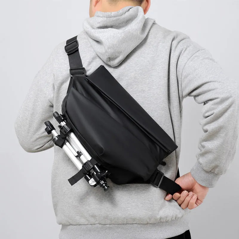 Grey men's PU leather crossbody bag showing front zipper and adjustable strap.